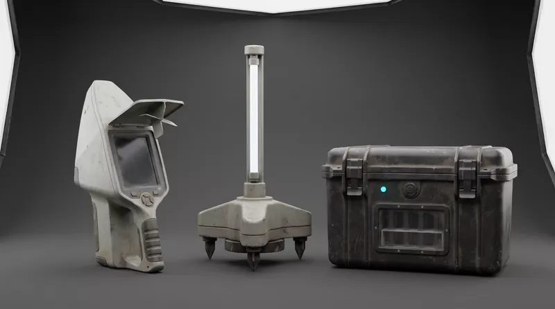 Three props on a grey backdrop: a handheld scanner with a vaned hood, a spiked ground beacon topped with a lit tube, and a hard transport case.