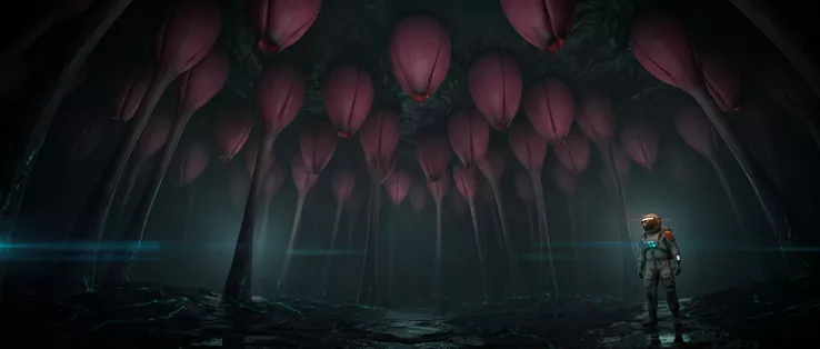 Dozens of closed pink buds hanging from dark stalks in a low dark hall, the astronaut standing small at the right